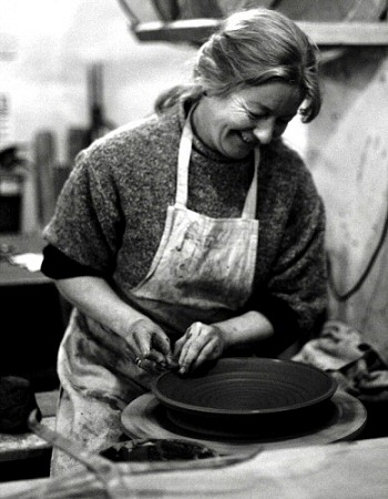 Deborah Prosser throwing a shallow bowl